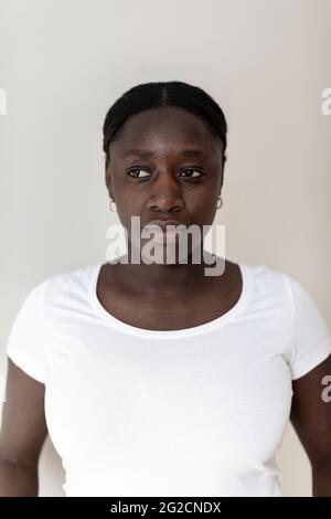 Mid adult woman looking away Stock Photo