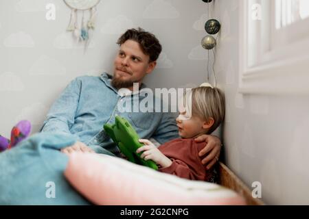Father with son using digital tablet Stock Photo