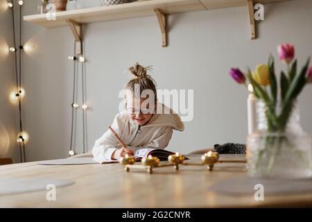 Girl doing homework Stock Photo