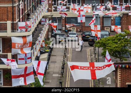 London, UK. 10th June, 2021. Football-mad residents in Bermondsey's Kirby Estate in south-east London have put up around 400 England (cross of St George) flags ahead of the European Championship which starts this weekend and is in fact the Covid-delayed 2020 tournament. Credit: Guy Bell/Alamy Live News Stock Photo