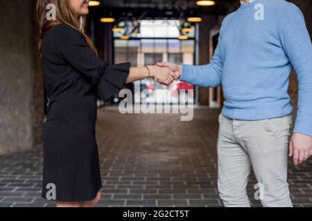 Man and woman shaking hands Stock Photo