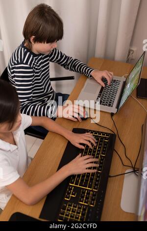 Boys using computers at home Stock Photo