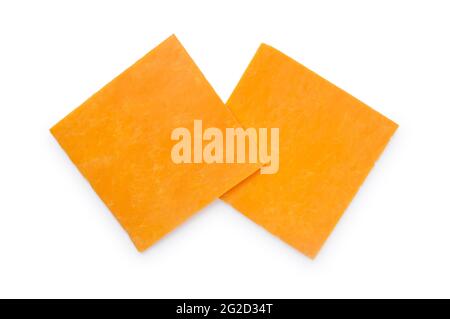 Studio shot of thinly sliced, square shaped, Red Leicester cheese cut out against a white background - John Gollop Stock Photo