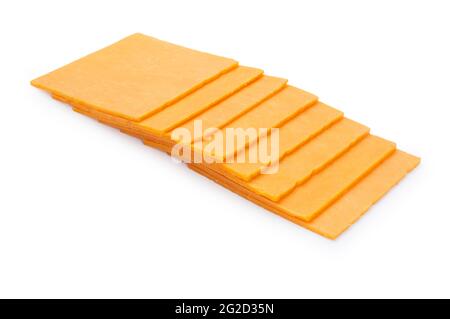 Studio shot of thinly sliced, square shaped, Red Leicester cheese cut out against a white background - John Gollop Stock Photo