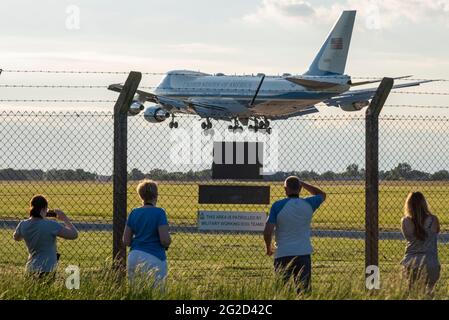 US President Joe Biden arriving at RAF Mildenhall, Suffolk, UK, in Air Force One USAF Boeing VC-25A plane, with enthusiasts watching behind fence Stock Photo