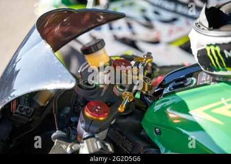 Motorcycle dashboard with windshield, gear indicator, RPM tachometer, odometer, speedometer, ABS light, oil light warning, button controls, fuel gauge Stock Photo