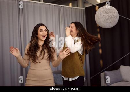 Happy female coworkers at work Stock Photo