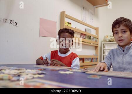 Smiling boys in classroom Stock Photo
