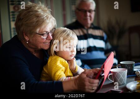 Grandmother and granddaughter using digital tablet Stock Photo