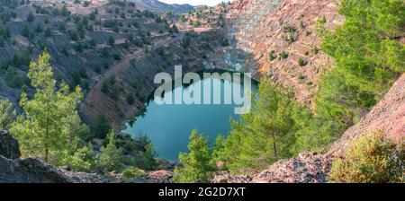Ecosystem restoration. Reforestation in former open pit mine area, panoramic view Stock Photo
