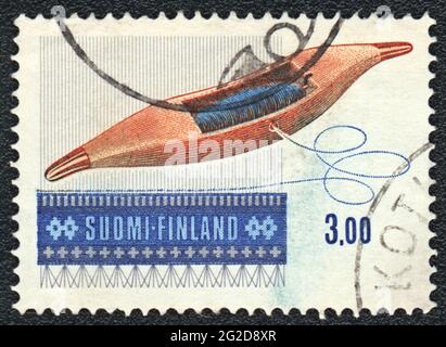 A stamp printed in FINLAND shows Weft and pattern, simbol of folk weaving, Finland, circa 1979 Stock Photo