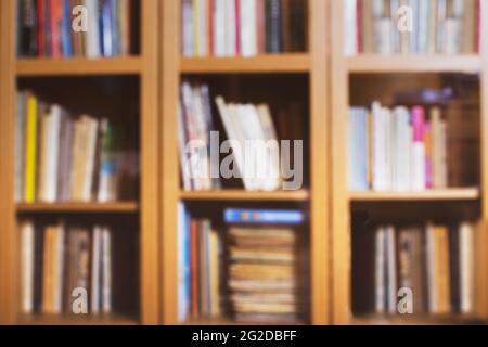Blured home library background with colorful books. Stock Photo