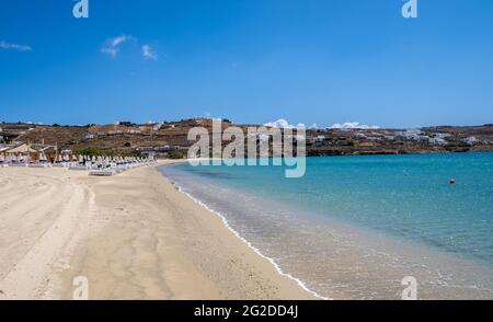 Sandy beach background, Soft ocean wave on sand. Empty beach, space, summer holidays card and advertisement template. Clear blue sky, calm sea backgro Stock Photo