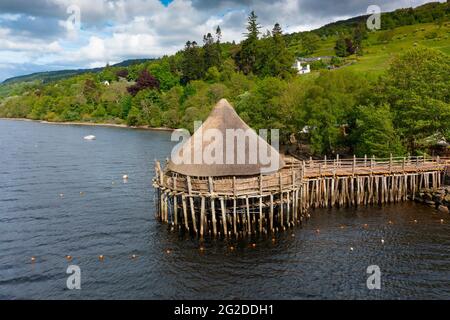 Crannog Iron Age loch dwelling at the Scottish Crannog Centre on Loch Tay at Kenmore in Perthshire , Scotland, UK. Destroyed by fire 2 days later. Stock Photo