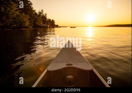 Canoe on Lake Winnepesaukee at Sunset, Tuftonboro, New Hampshire Stock Photo