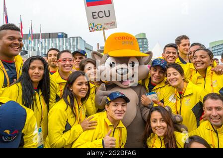 Athletes from Ecuador posing for photograph with the mascot Pachi the Porcupine at the 2015 Pan Am Games, Toronto. Pan-Am Games were a major internati Stock Photo