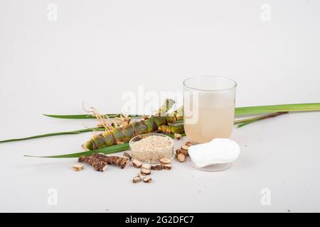 Fresh and dried Acorus calamus roots, also known as sweet flag, calamus leaves and powder, tonic for skin and hair. For personal care products, beauty Stock Photo