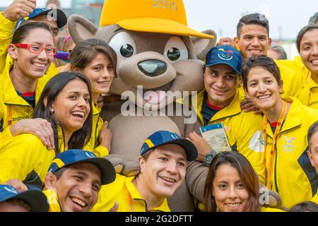 Athletes from Ecuador posing for photograph with the mascot Pachi the Porcupine at the 2015 Pan Am Games, Toronto. Pan-Am Games were a major internati Stock Photo