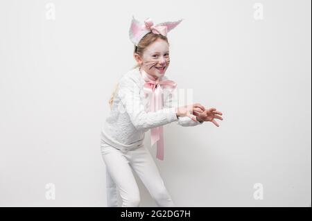 A young girl dressed up in a cat costume for world book day. Stock Photo