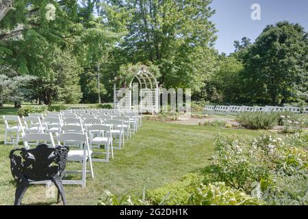 Chairs arranged for a wedding in the garden Stock Photo