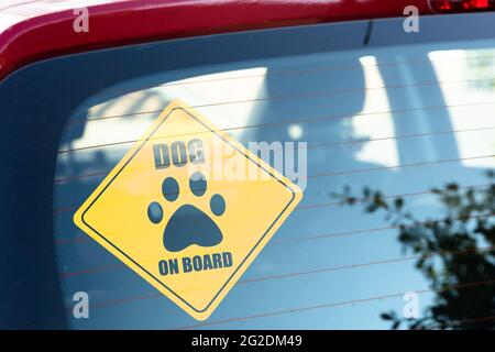 Dog On Board Sign. Car Window Sticker Stock Photo