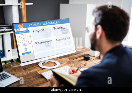 Human Resources Software On HR Manager Computer Screen Stock Photo