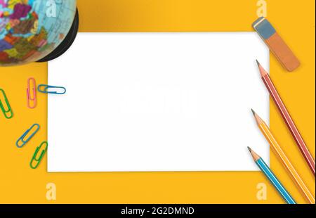 Blank paper card mockup with school stationery on a orange background, pencils, the globe, top view Stock Photo