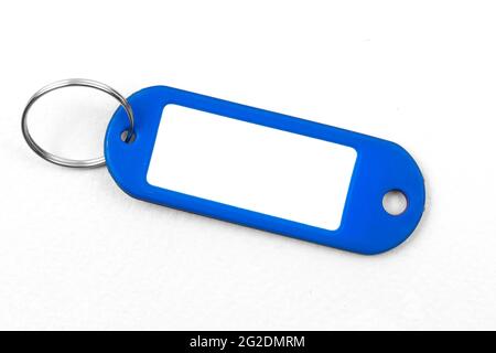Blank blue name badge mockup design, plastic mamecard with key ring on a white background, copy space Stock Photo