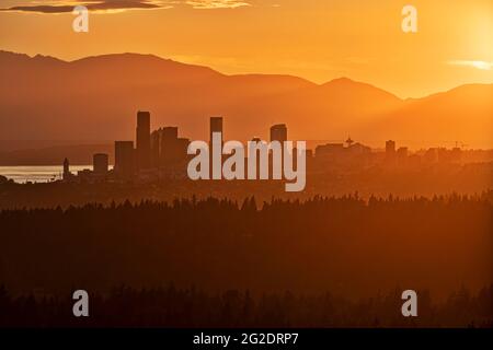 Amazing View of Seattle From Far Away with mountain tops on the horizon Stock Photo