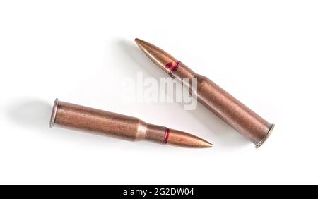 Two copper machine gun bullets isolated on white background Stock Photo
