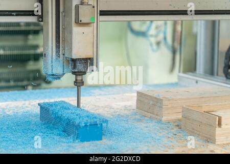 CNC drill machine cutting mold from plastic, close up. Stock Photo