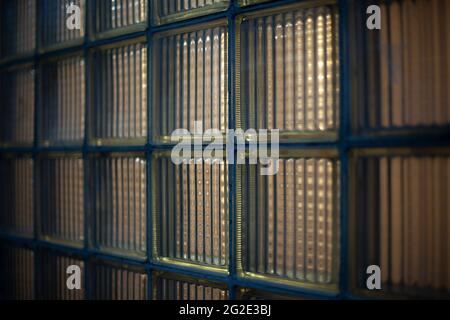 Tiled glass in the building. Thick glass does not allow much light to pass through. Double-glazed window for isolation from noise and sun rays. Stock Photo