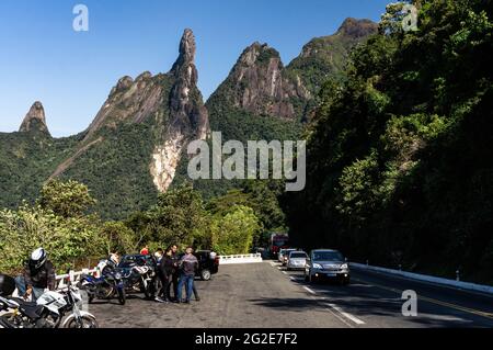 Parking spot of Soberbo viewing spot at Rio-Teresopolis highway (BR-116) with Our Lady finger, God's Finger and Cabeca de Peixe peaks at the back. Stock Photo