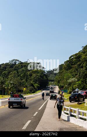 Traffic passing by Rio-Teresopolis highway nearby Soberbo viewing spot, heading north under clear blue sky sunny day. Stock Photo