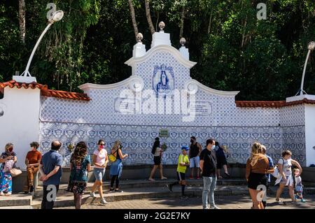 The Judite fountain full of tourists at it. This is a 1920 built freshwater fountain located at Dona Olga de Oliveira street in Alto district. Stock Photo