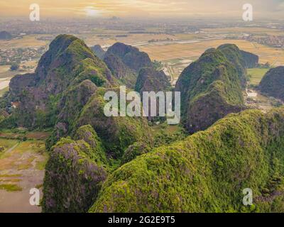 the majestic scenery on Ngo Dong river in Tam Coc Bich Dong view from drone in Ninh Binh province of Viet Nam Stock Photo