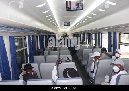 Lagos. 10th June, 2021. People try out a train trip following a ceremony to flag off the commercial operation of the Lagos-Ibadan railway at the Mobolaji Johnson Railway Station in Lagos, Nigeria on June 10, 2021. Nigeria on Thursday officially started the full commercial operation of a China-assisted railway linking the southwestern cities of Lagos and Ibadan, to ease public transportation and fuel goods movement in the west African country.TO GO WITH 'Roundup: Nigeria flags off full commercial operation of China-assisted railway' Credit: Emma Houston/Xinhua/Alamy Live News Stock Photo