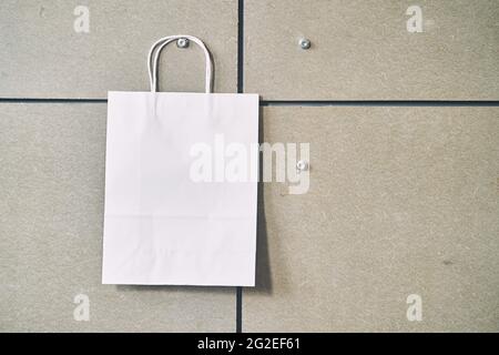 White paper disposable bag on gray background Stock Photo