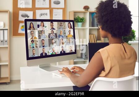 Woman having an online business conference or a video call meeting with colleagues Stock Photo