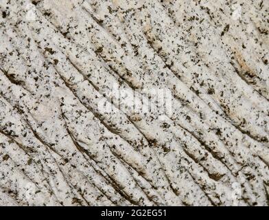 The structure of light stone with black blotches background Stock Photo