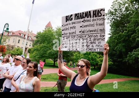 Bloomington, US. 10th June 2021. A protester holds a placard during the demonstration.Anti-vaxxers and anti-maskers gathered at Indiana University's Sample Gates to protest against mandatory Covid vaccinations IU is requiring for students, staff and faculty during the upcoming fall semester. The protesters say their constitutional rights are being infringed, and have launched a law suit. Credit: SOPA Images Limited/Alamy Live News Stock Photo