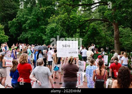 Bloomington, US. 10th June 2021. Protesters gather at Indiana University's Sample Gates during the demonstration.Anti-vaxxers and anti-maskers gathered at Indiana University's Sample Gates to protest against mandatory Covid vaccinations IU is requiring for students, staff and faculty during the upcoming fall semester. The protesters say their constitutional rights are being infringed, and have launched a law suit. Credit: SOPA Images Limited/Alamy Live News Stock Photo