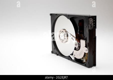 An opened hard disk drive isolated on white background. Stock Photo