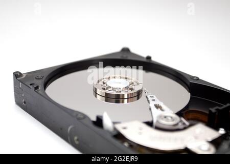 A hard disk drive isolated on white background. Closeup of opened HDD Stock Photo