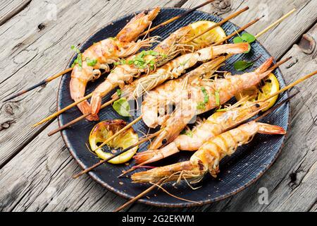 Grilled langoustines,prawn roasted on a skewer.Grilled seafood plate Stock Photo