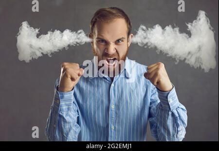 Angry man with smoke coming out from his ears Stock Photo - Alamy