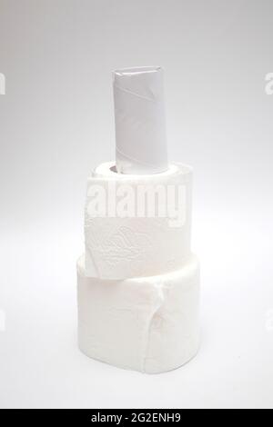 A stack of toilet paper rolls on white background. Stock Photo