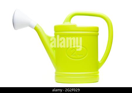Green plastic watering can isolated on white background Stock Photo