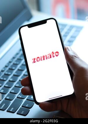 Assam, india - June 7, 2021 : Zomato logo on phone screen stock image. Stock Photo