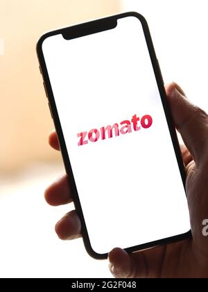 Assam, india - June 7, 2021 : Zomato logo on phone screen stock image. Stock Photo